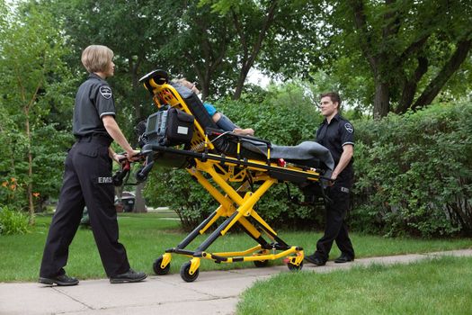 Medical team transporting patient on stretcher