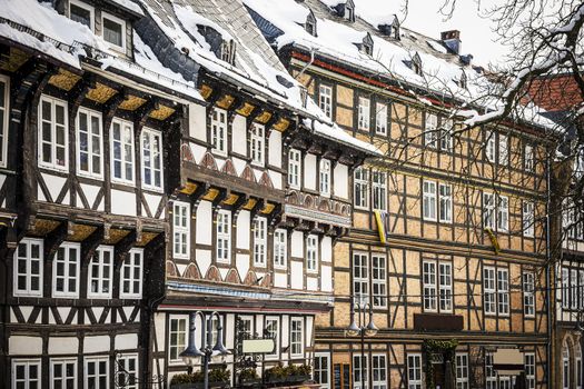 Closeup of half-timbered houses in Goslar, Germany in winther with snowfall