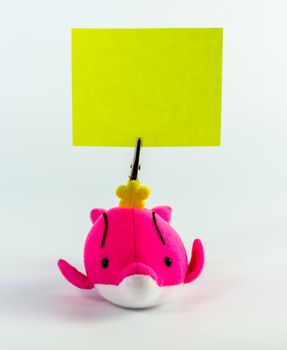 holder in form of Pink Whale doll with memo isolated on white