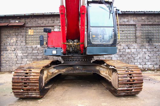 Red excavator on a construction site