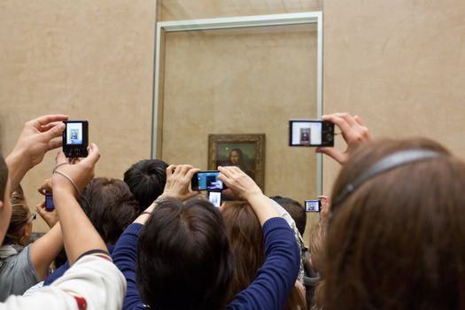 Audience near the picture "Mona Lisa" on October 3, 2012 in Louvre Museum, Paris, France. With 8,5m annual visitors, Louvre is the most visited museum worldwide