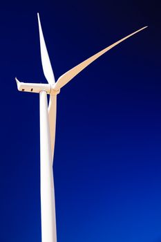 Wind Turbine Abstract.  White Wind Turbine and Blades Against Blue Sky Palouse Hills Washington
