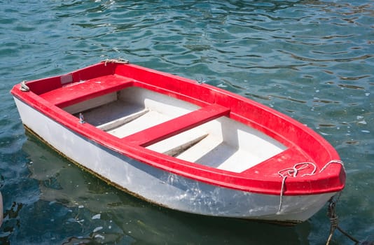 Red and white boat on the water