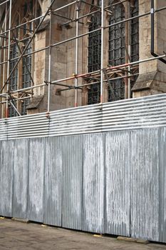 Scaffolding on a medieval english church undergoing repairs