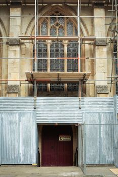 Scaffolding on a medieval english church undergoing repairs