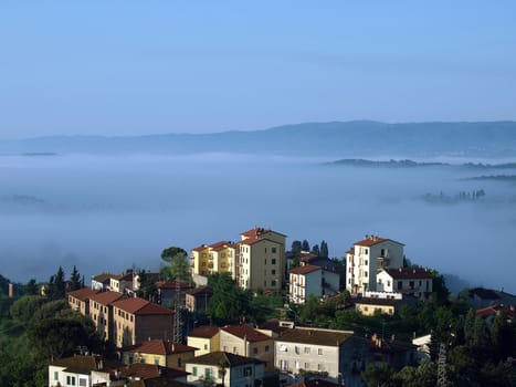 Fabulous landscape of the foggy morning in Tuscany. The valley between Montepulciano and Chiusi