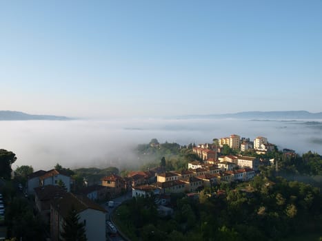 Fabulous landscape of the foggy morning in Tuscany. The valley between Montepulciano and Chiusi
