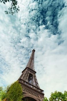 Eiffel Tower against the blue sky and clouds. Paris. France.