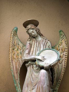 Sculpture of an angel with tambourine. Chiusi , Tuscany, Italy