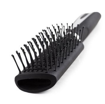 Closeup view of black comb isolated over white background