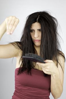 Angry beautiful woman loosing hair