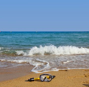 Swimming mask on sea beach travel vacation concept