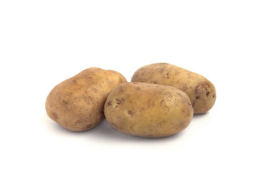 Three potatoes close up isolated on white background
