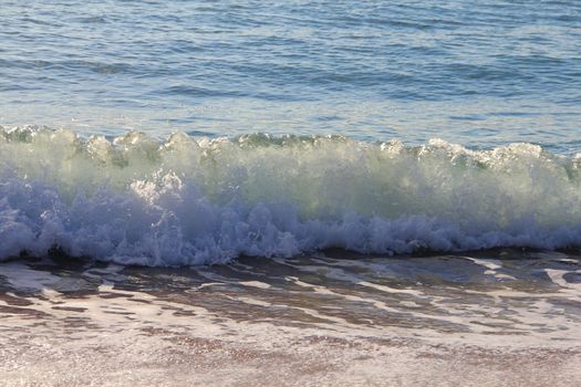 View on surf at beach of tropical sea