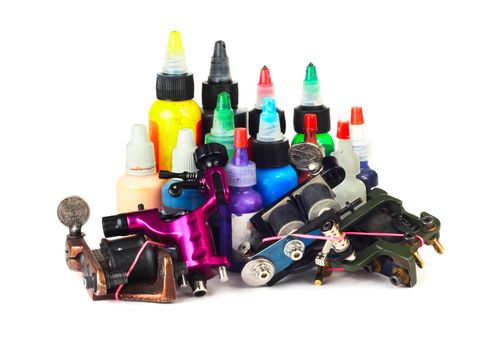 Tattoo machine with many color ink bottles isolated white background