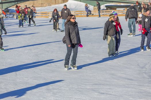  Ice skaters in a Skating Rink in Old Port of Montreal. Quebec, Canada.