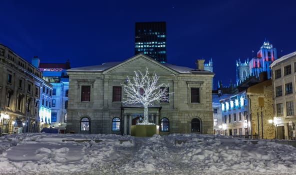 Beautiful tree in garlands in Old Montreal at evening in Quebec Canada