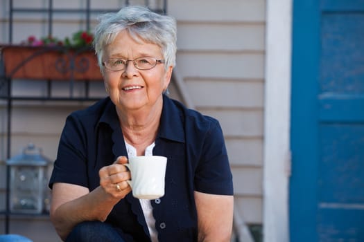 Lovely senior woman having a cup of tea