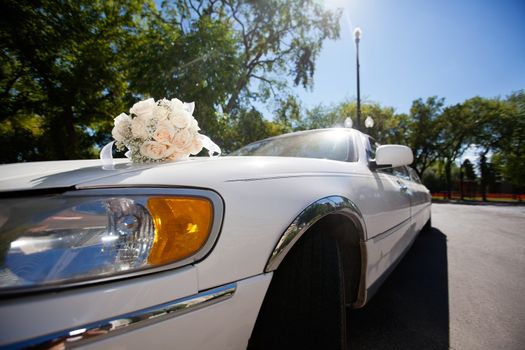 Wedding car decorated with bouquet