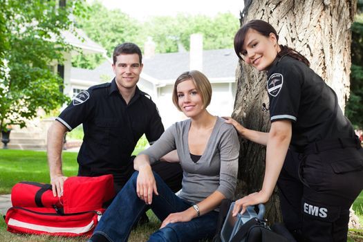 Portrait of emergency team with healthy recovering patient