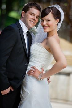 Portrait of cute young married couple posing