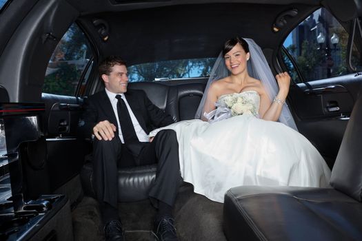 Newlywed in a luxury wedding limousine