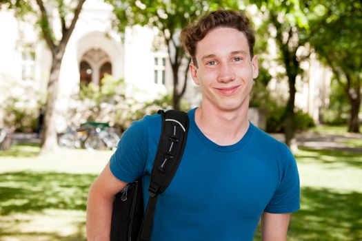 Happy male student on a university campus