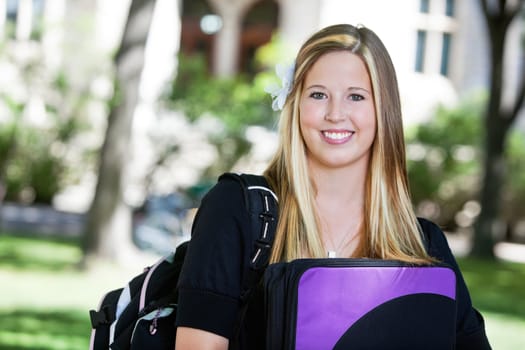 Portrait of sweet looking college girl with backpack
