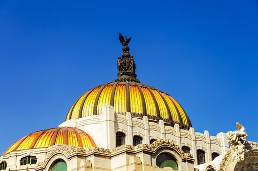 The orange and yellow dome of the Palacio de las Bellas Artes in Mexico City