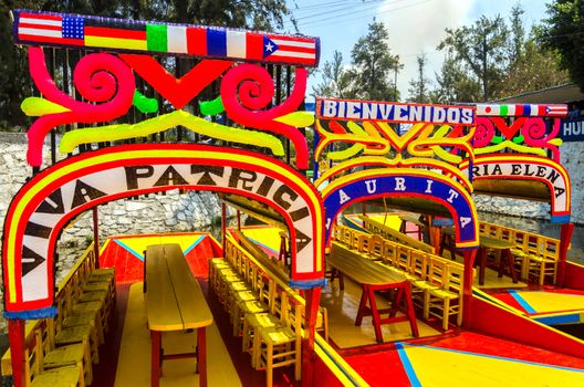 The clorful boats on ancient Aztec canals at Xochimilco in Mexico City