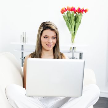 woman on sofa with computer