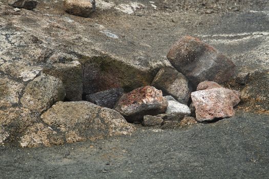 Steam escaping from a hole covered by rocks in the kilauea crater