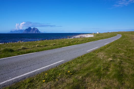 Scenic coastal road on Lofoten islands in Norway on sunny summer day