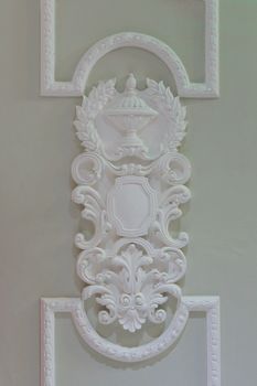 decorative moldings on the white wall