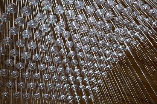 abstract strings and crystals arranged in geometric pattern.