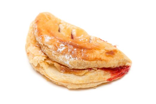 appetizing bun with jam and powdered sugar. Isolate on white.