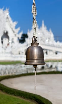 bell on the front of the White Temple Chiang Mai, Thailand