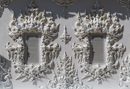 windows in the building of the White Temple in Chiang Mai, Thailand