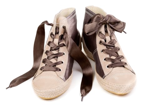 Pair of fashionable sneakers, isolated on white background