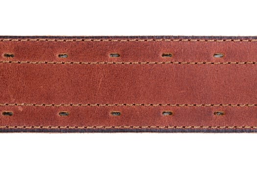 Fragment of a leather belt close-up on white background