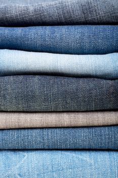stack of blue jeans background colors