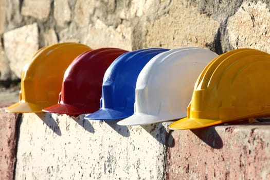 Some helmets close up on work place 