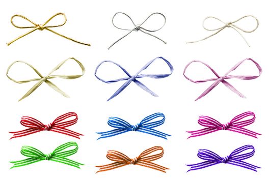 A selection of various plain and patterned tied bows in a variety of materials, cut out and isolated on white.