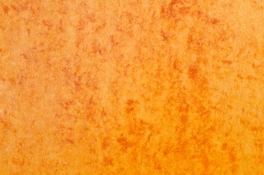 Orange paper texture background with red marble effect.