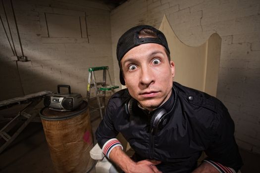 Startled young man with backward baseball hat