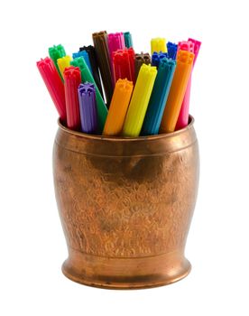 closeup of motley colorful felt-tip felt tip pens in copper bowl isolated on white background