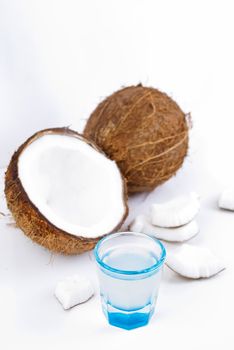 freshly cut coconut and milk isolated on white background