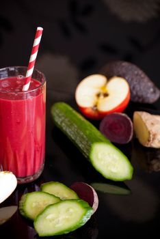 healthy juice made of variety fresh organic fruits and vegetables