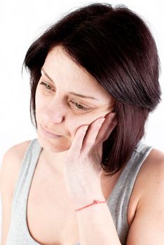 young woman with tooth ache making massage to avoid pain