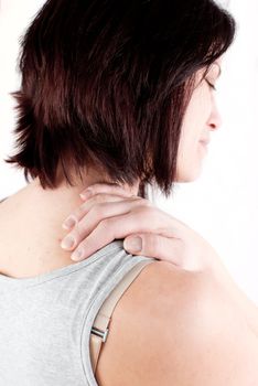 young woman with neck ache making massage to avoid pain